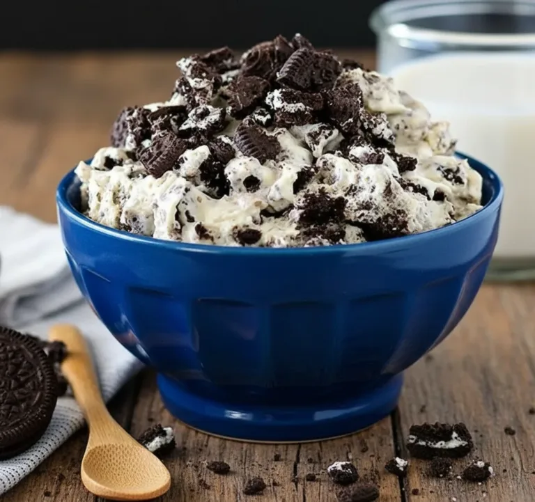 Delicious homemade Oreo Mousse topped with crushed Oreos and whipped cream
